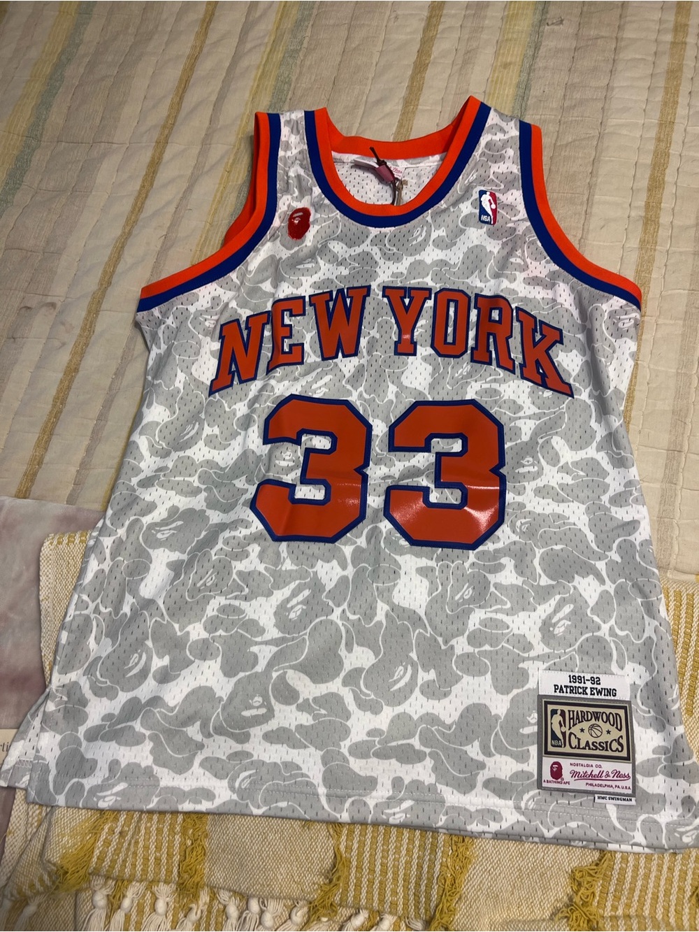 BAPE x Mitchell & Ness New York Knicks Ewing Jersey in White, Orange & Blue